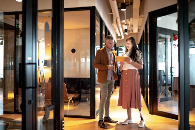 A woman consulting with her Long Beach disability lawyer
