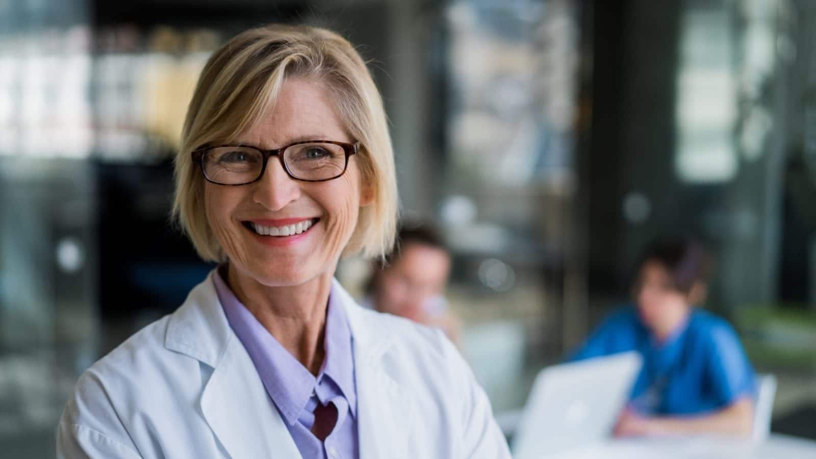 Happy female doctor in hospital
