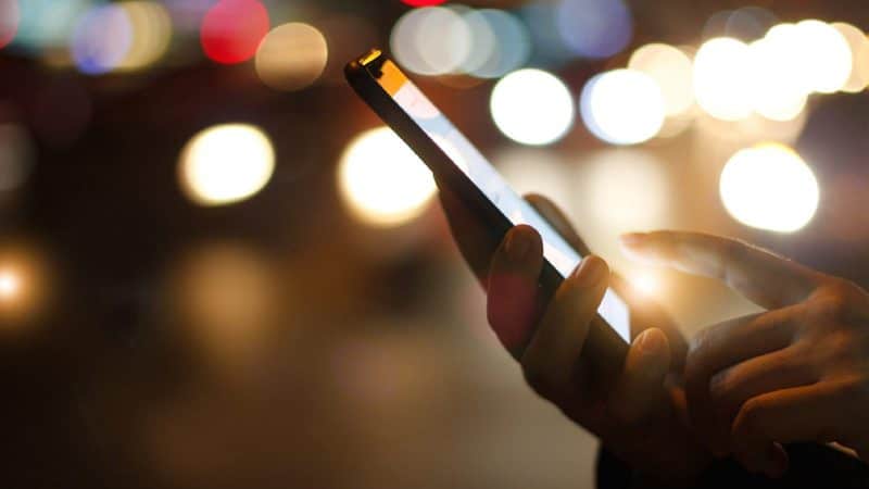 Female Posting To Social Media Using Smart Phone