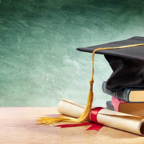 A graduation cap and a diploma.