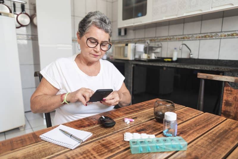 A woman with diabetes checking her blood sugar levels.